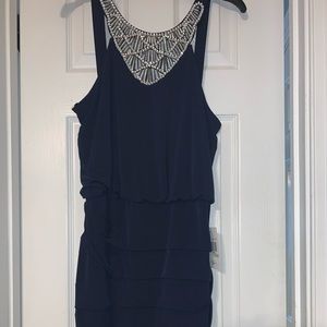 Navy blue cocktail dress with rhinestone accent